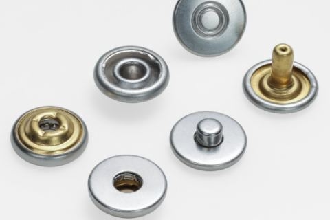 金属纽扣的起源与发展是怎样的