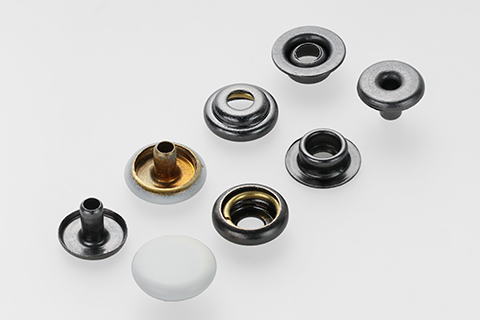 金属四合扣是如何应用在服装上的?